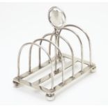 A Victorian silver 5 bar toast rack hallmarked Birmingham 1895 . Approx 4" long Please Note - we