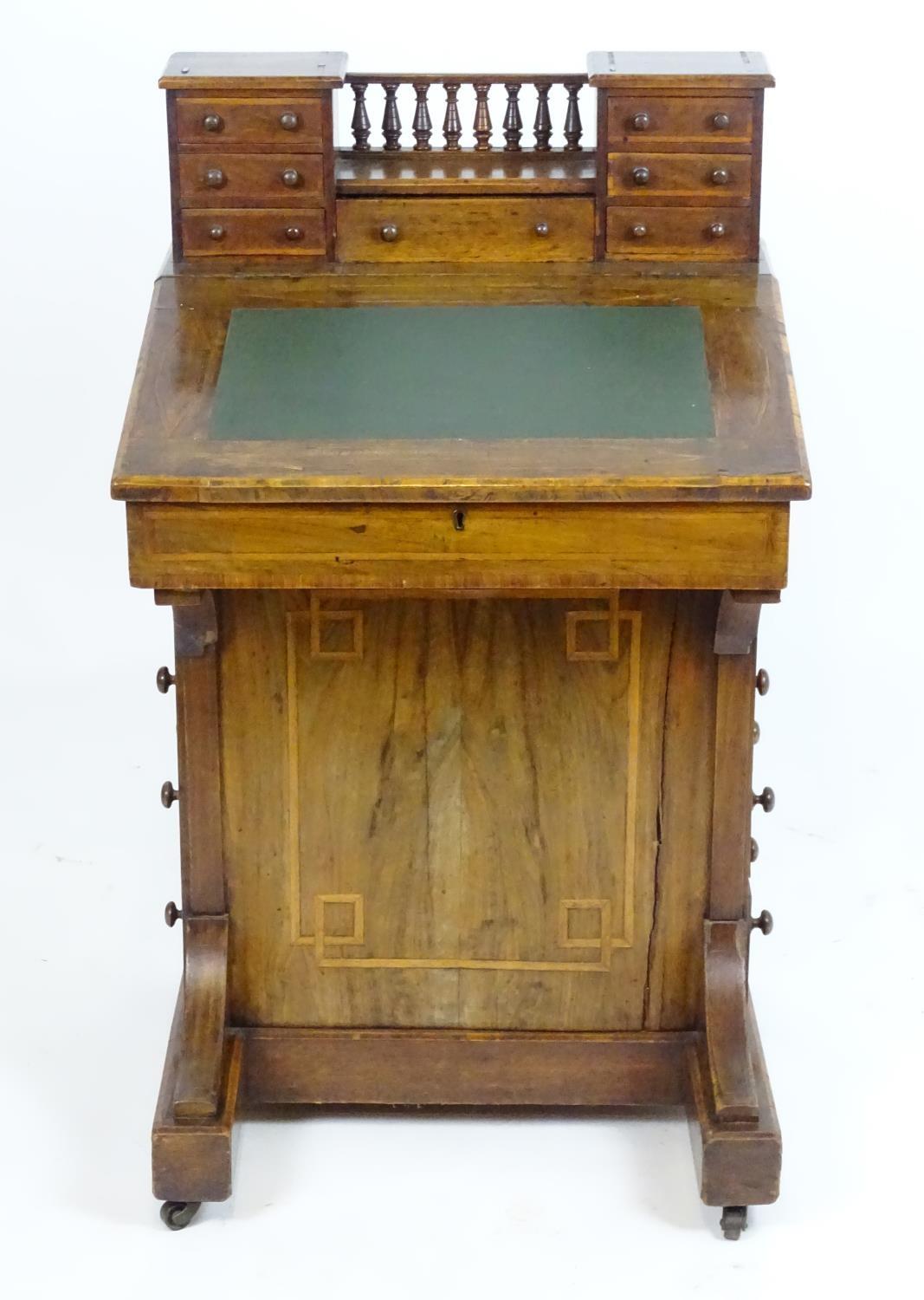 A mid / late 19thC walnut davenport with two banks of three short drawers together with a central - Bild 3 aus 8