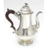 A 19thC Old Sheffield plate coffee pot with floral formed finial to lid