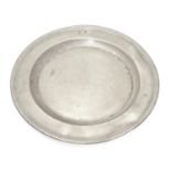 A pewter plate / charger stamped to rim IHA, and stamped with touch marks under. 15" diameter