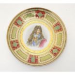 A German cabinet plate depicting a portrait of King Louis XIV with gilt border. Titled and signed