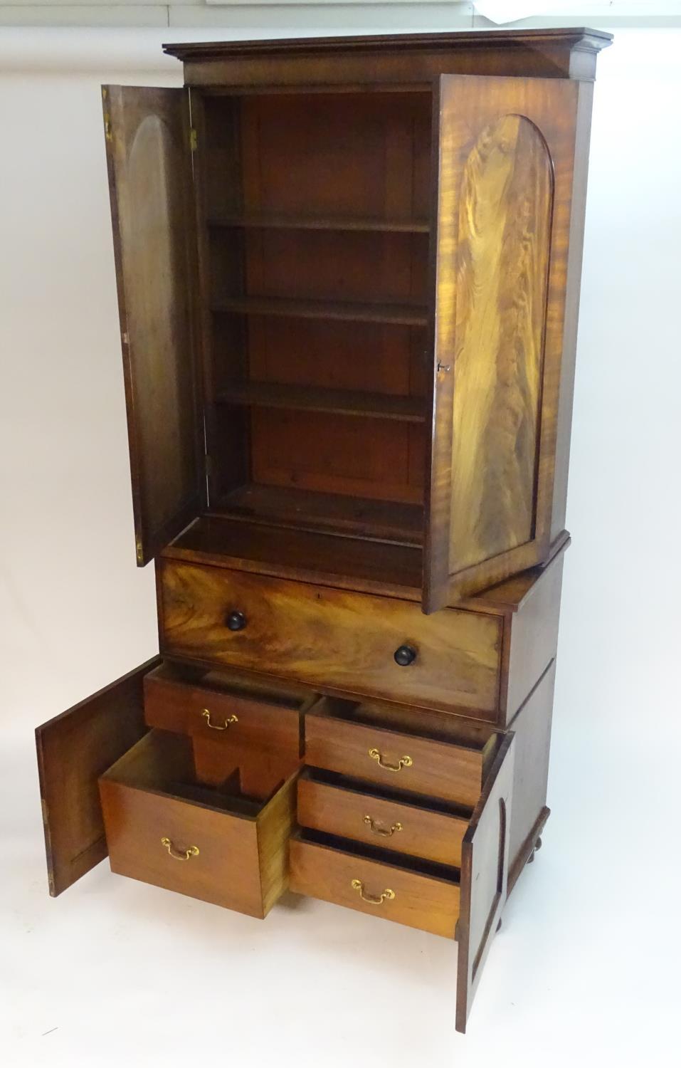 A mid 19thC mahogany secretaire bookcase, having a moulded cornice above two flame mahogany panelled - Bild 5 aus 8