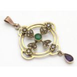 A 9ct gold pendant of Edwardian suffragette manner, set with green violet and white seed pearls. The