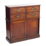 A late 19thC / early 20thC mahogany cabinet with four small drawers to the side and having