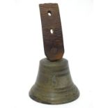 A butlers bell numbered '6' with part leather strap . The bell 2 1/2" high Please Note - we do not