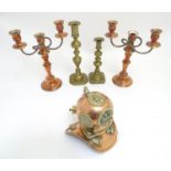 A selection of copper and brass items, comprising a pair of copper candelabra, two brass