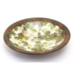 A studio pottery circular shallow dish / bowl by Ralph Jandrell, decorated with hand painted oak