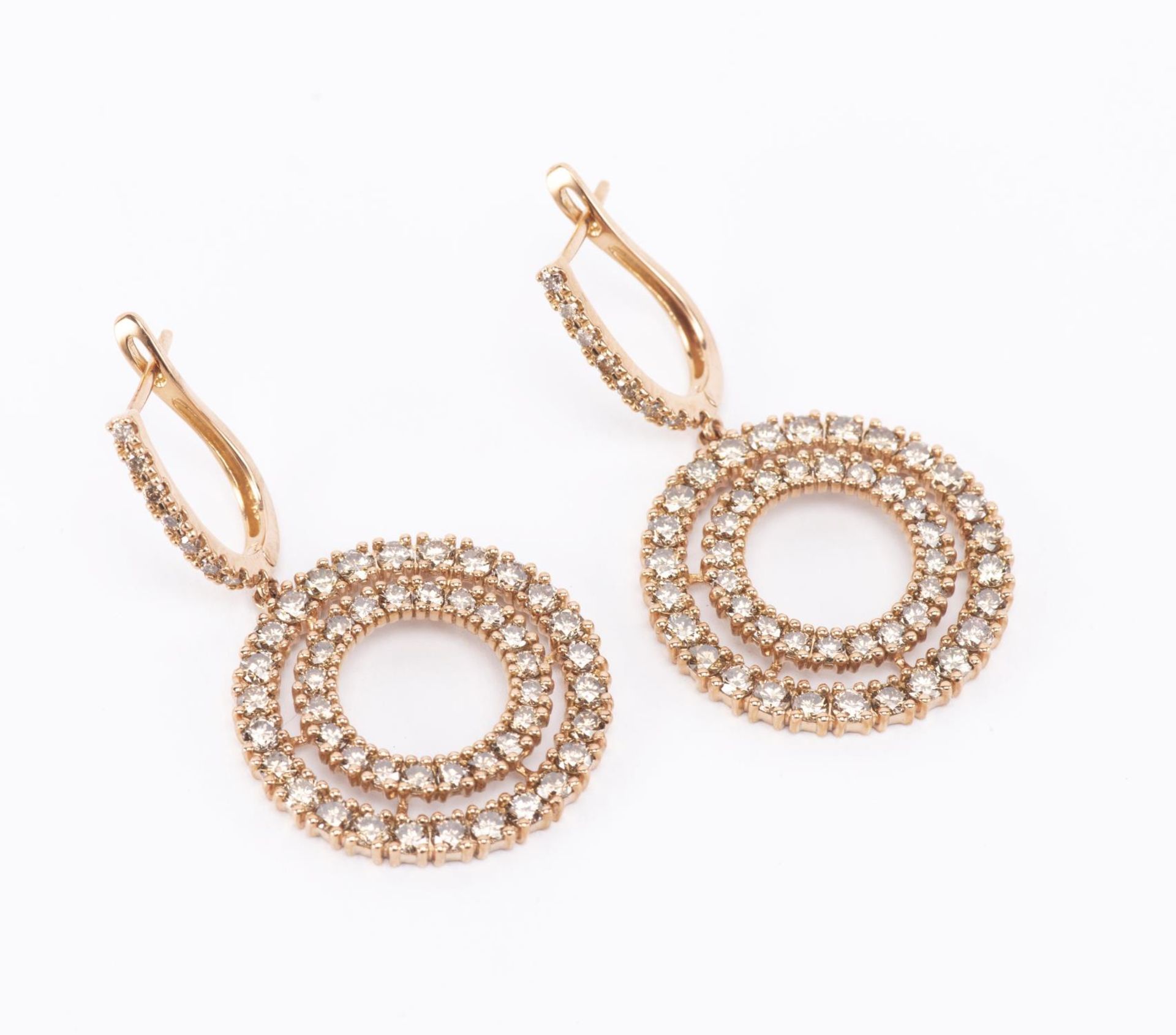 Boucles d'oreilles en or rose .750 avec 2 cercles de diamants champagne pour un total [...]