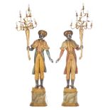 Paire de porte-torchères en bois sculpté peint et doré représentant deux garçons [...]