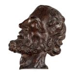 * Oak carving. A 17th century carved oak profile of a man