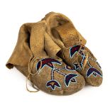 * Native American Indian. A pair of Woodland beadwork moccasins, 19th century