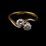 * Ring. A Platinum and 18ct gold 2-stone diamond ring