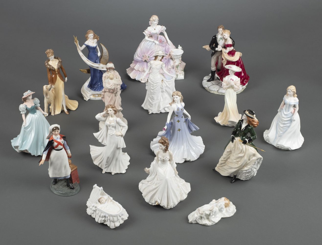 * Figurines. A large collection of Royal Doulton and Royal Worcester figurines