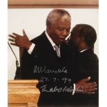 * Mandela (Nelson, 1918-2013). A close up photograph of Nelson Mandela and Thabo Mbeki