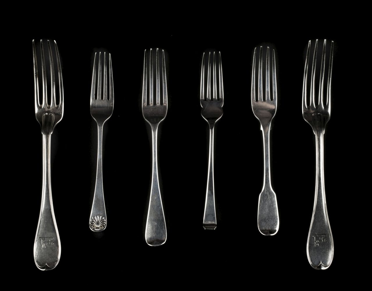 * Spoons. A collection of dessert and table spoons