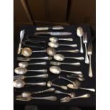* Mixed Silver. A collection of silver including dessert spoons