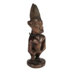 * Nigeria. An Ibeji wooden figure