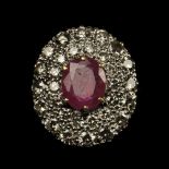 * Ring. An 18ct gold & platinum diamond and ruby ring