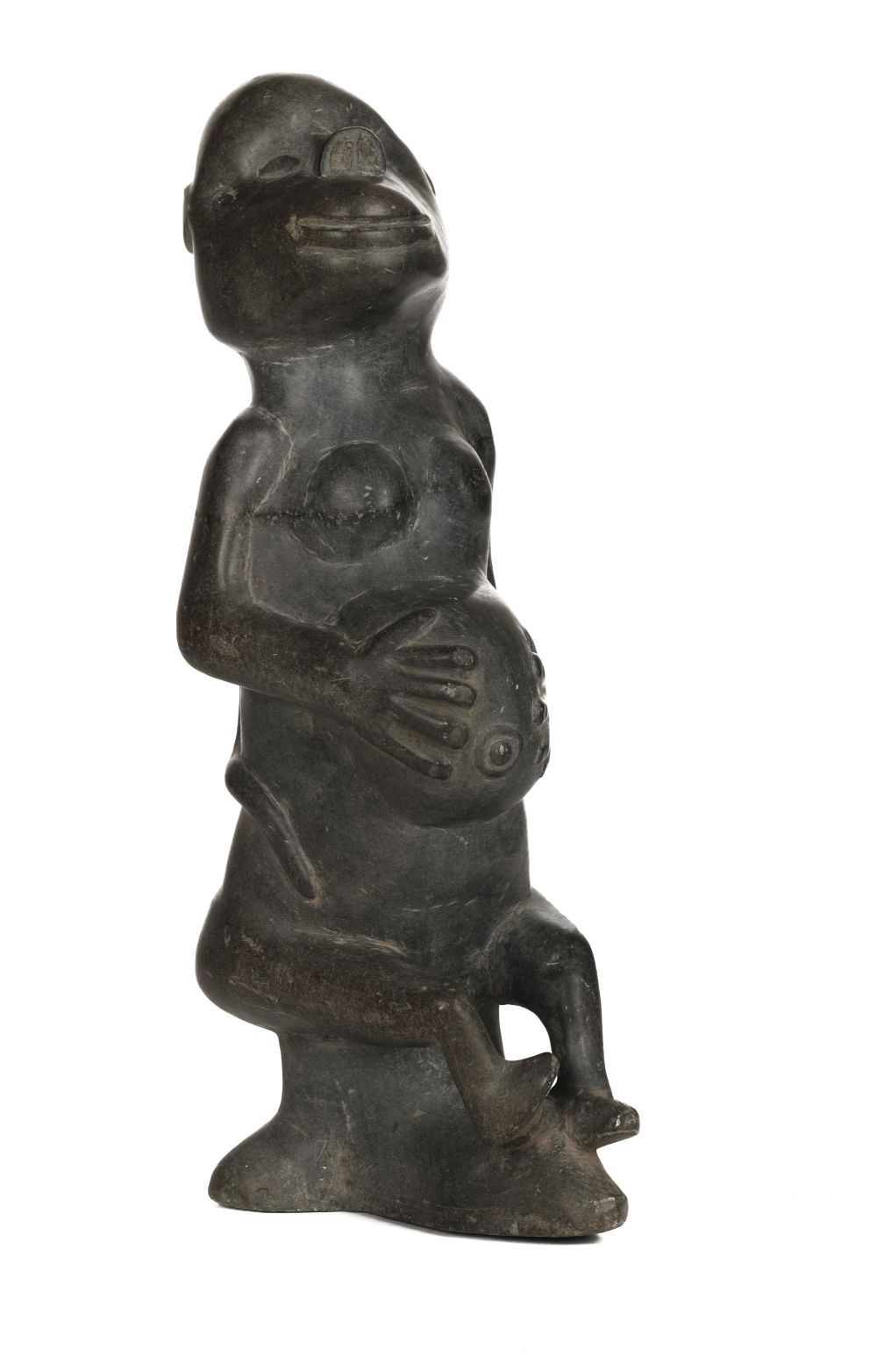 * African Carving. A 20th century hardstone fertility figure and shield