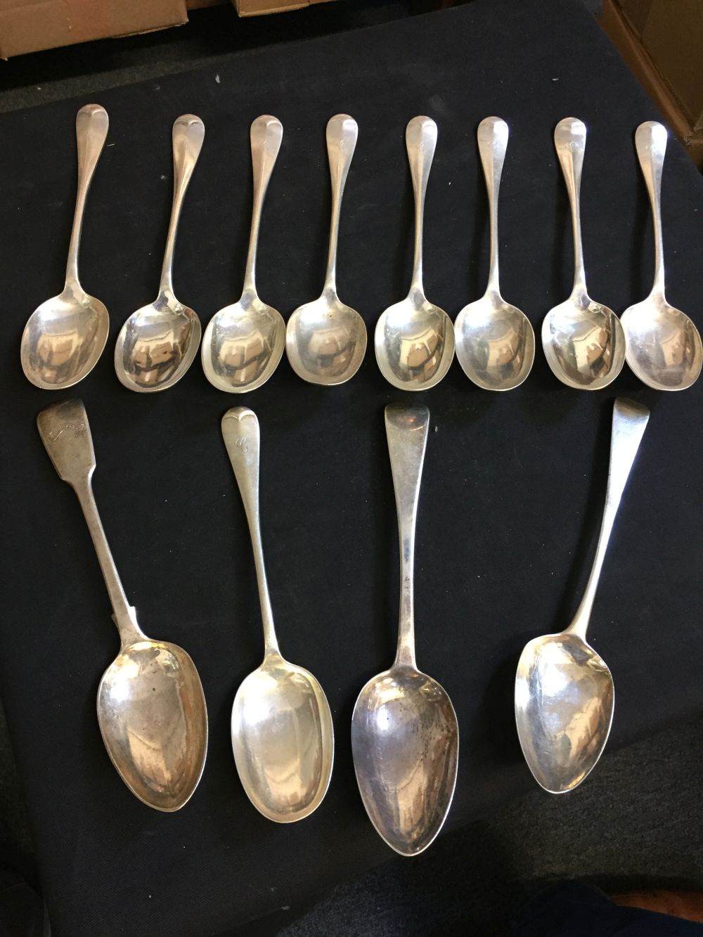 * Spoons. A collection of silver serving spoons