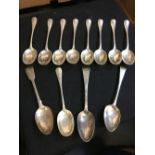 * Spoons. A collection of silver serving spoons