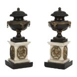 * Candle Vases. A pair of Regency bronze and marble urns