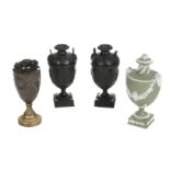 * Wedgwood. A pair of late 18th century 'Dancing Hours' black basalt urns