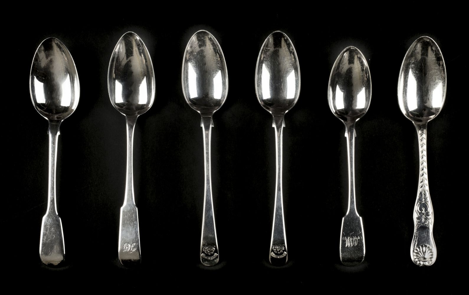 * Spoons. A collection of silver dessert spoons