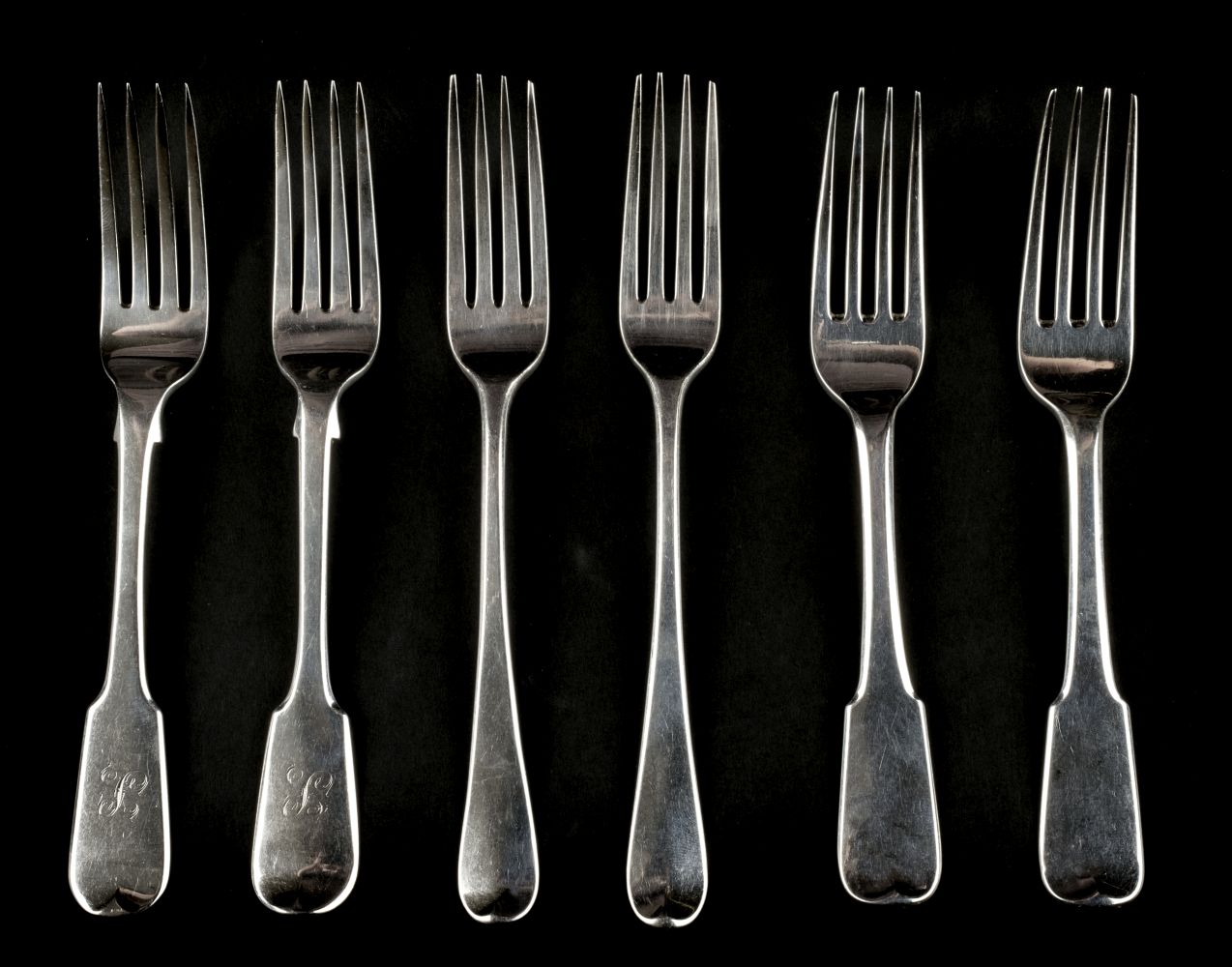 * Forks. A collection of silver table forks