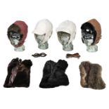* Motoring Apparel. A collection of leather helmets and gloves