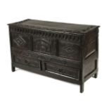 * Coffer. An 18th century carved oak mule chest