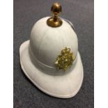 * Royal Marines topee. A Royal Marines topee, with brass helmet plate and ball finial ...