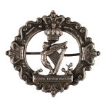 * Royal Irish Rifles. A Victorian silver brooch