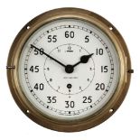 * Clock. A WWII period Royal Navy brass bulkhead clock