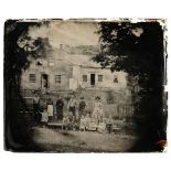 * Ambrotype. A three-quarter plate ambrotype of an American family outside their home, c. 1865
