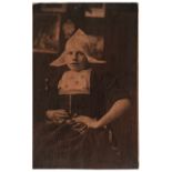 * Dutch School. Portrait of a Dutch girl in traditional dress, early 1900s, carbon print