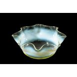 ATTRIBUTED TO JAMES POWELL & SONS: AN OPALESCENT VASELINE GLASS DISH
