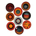 ALAN CLARKE FOR POOLE POTTERY: A SET OF NINE LIVING GLAZE "THE PLANETS" CHARGERS