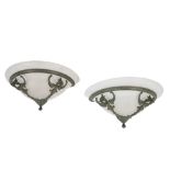 PAIR OF PATINATED METAL AND FROSTED GLASS WALL LIGHTS IN ART DECO TASTE