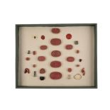 GROUP OF SIXTEEN RED COMPOSITION INTAGLIO CASTS