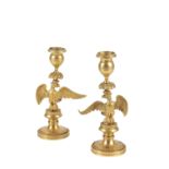 PAIR OF ORMOLU CANDLESTICKS CAST WITH SPREADEAGLES, EMPIRE OR POSSIBLY RUSSIAN