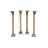 SET OF FOUR EGYPTIAN STRIATED ALABASTER AND GILT BRONZE MOUNTED COLUMNAR PEDESTALS