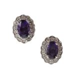 A PAIR OF AMETHYST AND DIAMOND CLUSTER EARRINGS