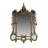 CARVED GILTWOOD AND COMPOSITION MARGINAL WALL MIRROR IN LOUIS XV STYLE