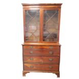 A LATE GEORGE III OR REGENCY MAHOGANY GLAZED BUREAU CHEST BOOKCASE