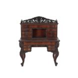 CONTINENTAL CARVED AND PART EBONISED WALNUT BUREAU DESK