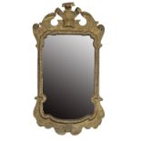 CARVED AND GILTWOOD FRAMED WALL MIRROR IN THE STYLE OF GILES GRENDEY