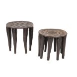 TWO SIMILAR AFRICAN CARVED AND STAINED HARDWOOD STOOLS