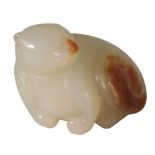 SMALL CELADON AND RUSSET CARVED JADE FIGURE OF A BEAR
