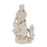 FINE BLANC-DE-CHINE FIGURE OF GUANYIN AND CHILD, QING DYNASTY